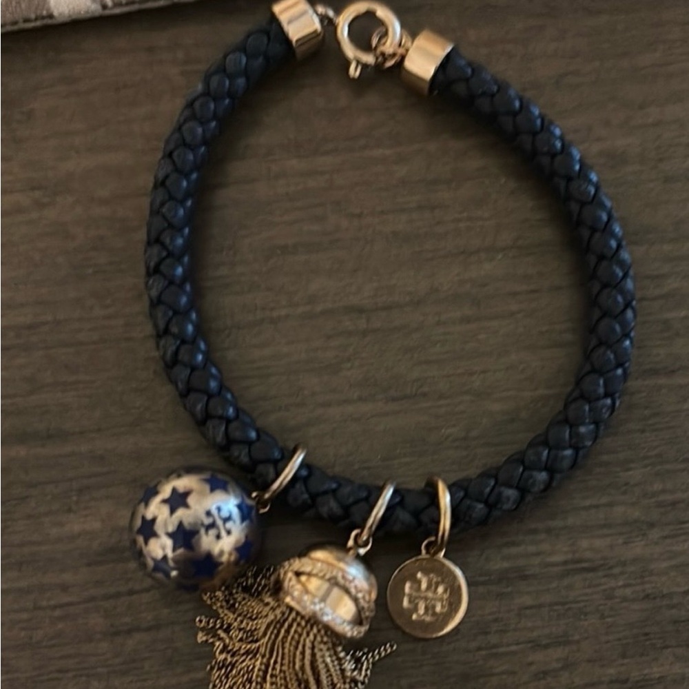 Tory Burch Gold and Blue leather band
Charm Bracelet. Excellent Condition